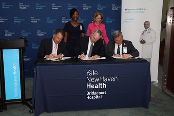 bridgeport and milford hospital integration signing