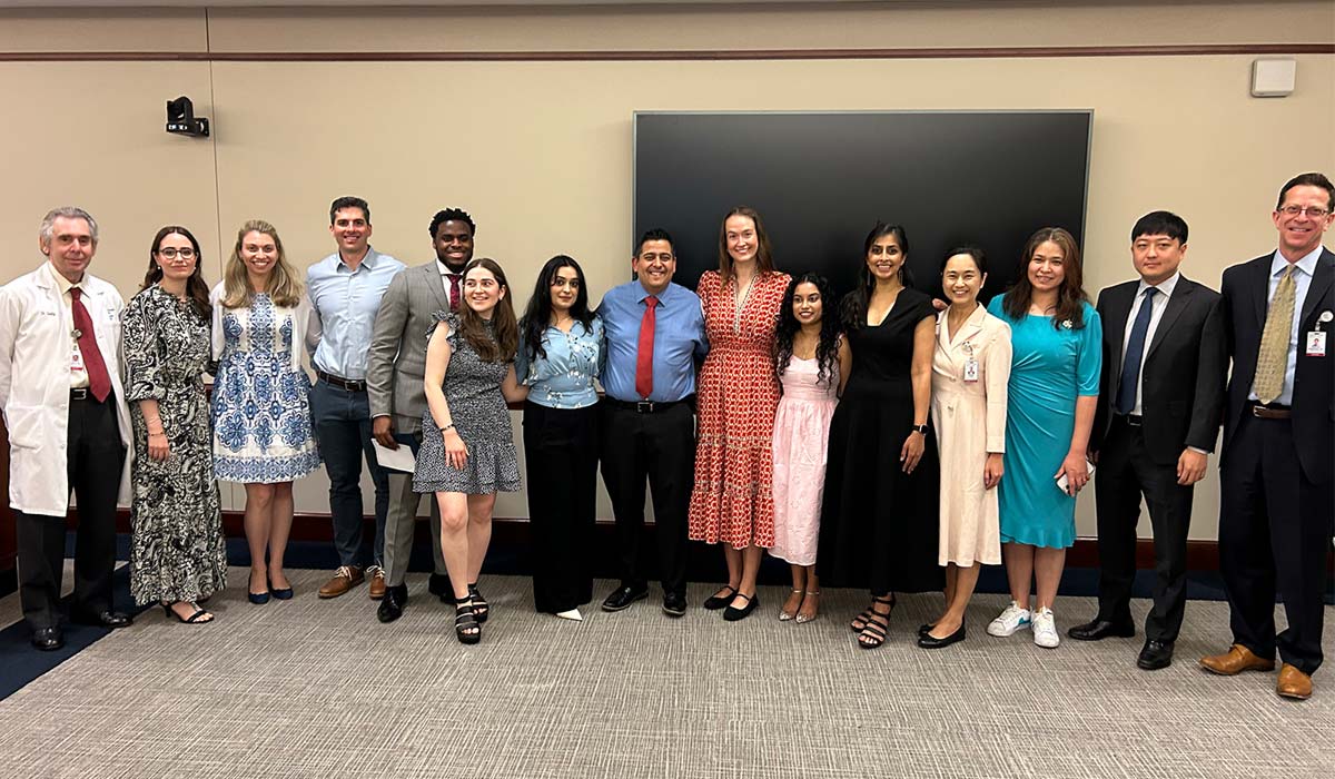 Charles B. Seelig, MD, (far left) and Jonathan Zimmerman, MD, (far right) celebrated with Greenwich Hospital residents and interns at a recent graduation ceremony.  